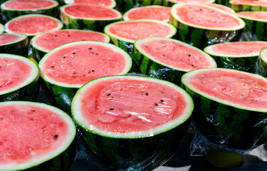 Watermelons cut half in market