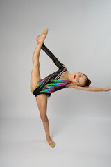 Portrait of a rhythmic gymnastics artist on a white background - 787064391