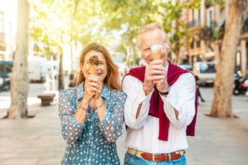 Senior couple eating ice cream and having fun in Barcelona - 787068585