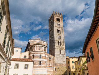 Basilica of San Frediano (St Fredianus) romanesque apse with medieval bell tower in Lucca historical center - 787069388