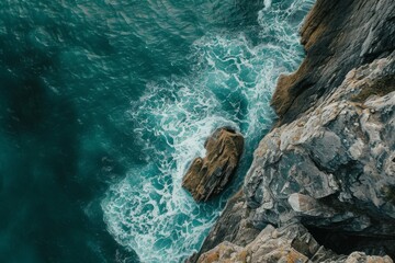A View of the Ocean From a Cliff, Aerial critique of rough, textured rocks breaking the monotony of calm sea waves, AI Generated - obrazy, fototapety, plakaty