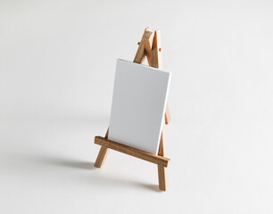 Stack of blank business cards on small wooden easel.