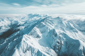 Fototapeta premium Aerial View of a Snowy Mountain Range, Aerial view of snow-covered mountain range, AI Generated