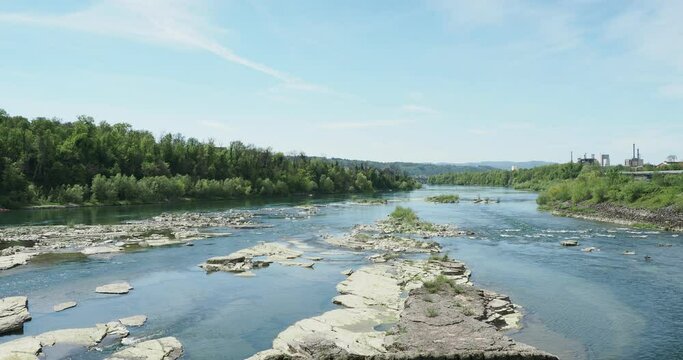 View of the Haut Rhin at low water under the passage of the hydroelectric power station after the Gwid weir. Appearance of flat and dry rocks attracting waterfowl

