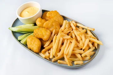 Gordijnen french fries with nuggts and cheese sauce © Maksim Shebeko