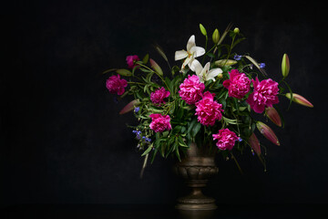 Bouquet of flowers in full bloom, dark background, space for text