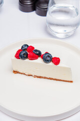 cheesecake with berries on the white - 787082979