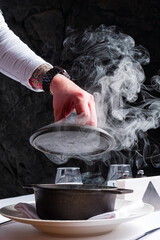 Chef cooking soup in the kitchen at restaurant. - 787083553