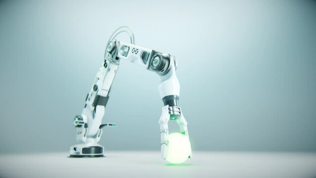 Training advanced high precision robot arm to catch a  glowing ball and drop it. White background. Industrial technology