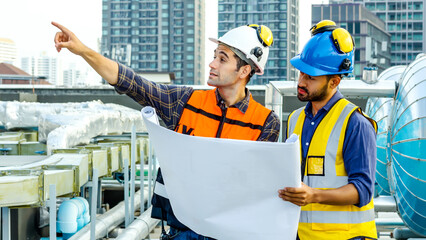 Contractor, Two civil engineers checking information from blueprint with teamwork, project manager...