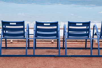 The famous blue chairs in Nice, on the Promenade des Anglais, looking out to the sea