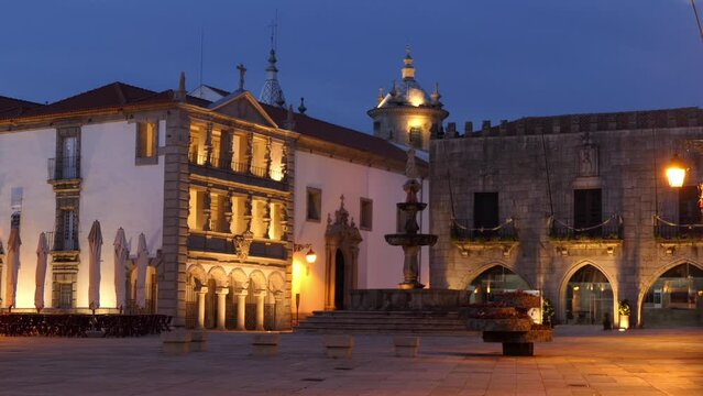 Misericordia Church and stone fountain in the evening on Republic Square in historic centre of Viana do Castelo city in Norte region of Portugal.