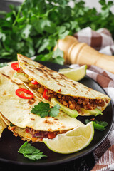 set of delicious fresh colorful quesadilla on a dark background