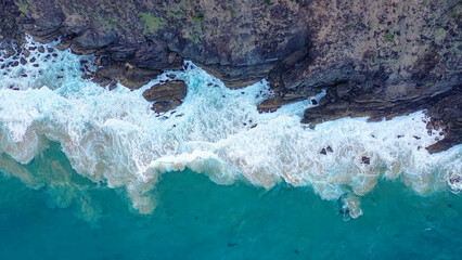 Incredible view of rocks and sea. White wave foam crashes against the rocks. Nusa Penida, Indonesia