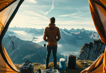 Man Standing on Mountain Top, Gazing Into Distance