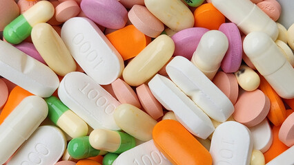 medicines in the form of mixed colored and shaped pills