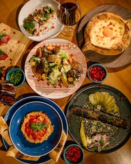 Eastern cuisine. Georgian fresh salad. Georgian national cuisine, food on the table in the restaurant. Oriental food. Authentic traditional meals