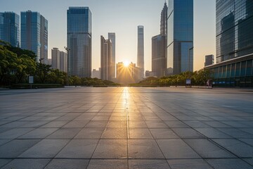 empty square concrete floor of a modern downtown with bright light coming during sunset from the...