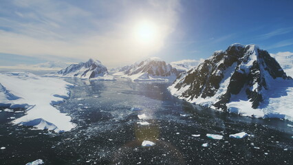 Sunset Over Lemaire Channel. Antarctica Aerial Flight Over Polar Ocean, Snow Covered Mountains....