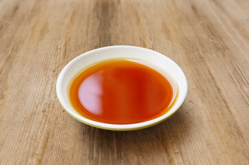 Phu Quoc Traditional Fish Sauce. Extract fish. Fish sauce in white bowl isolated. Authentic Phu Quoc Fish Sauce