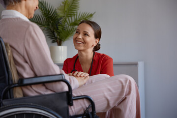 Medical nurse or social worker and elderly patient at nursing home - 787133142