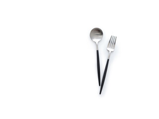Flat lay cutlery on white background, fork and spoon isolated overhead