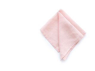 Flat lay with pink linen kitchen napkin isolated on white background. Folded cloth for mockup