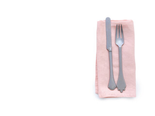 Flat lay with pink linen kitchen napkin isolated on white background. Folded cloth for mockup