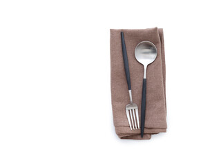 Overhead shot of a brown linen kitchen napkin isolated on white background. Folded cloth for mockup