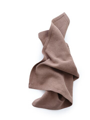 Overhead shot of a brown linen kitchen napkin isolated on white background. Folded cloth for mockup