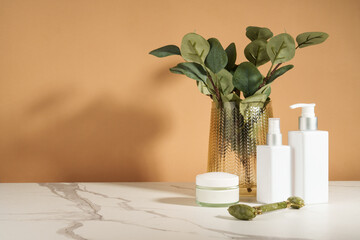 Bathroom with beauty products. Natural cosmetic, towels and vase with flowers. - 787143715