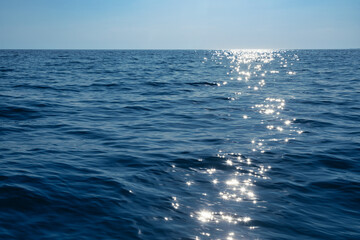 Sunlight dancing on serene ocean waves