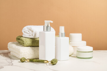Spa products in the bathroom. Shampoo, cream, towels. Natural cosmetic background. - 787143925