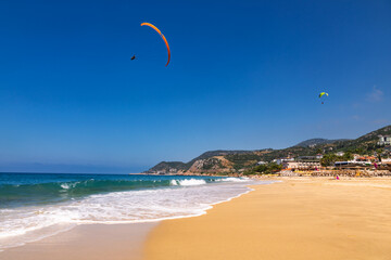 Paragliders soaring above Kleopatra Beach Alanya Turkey