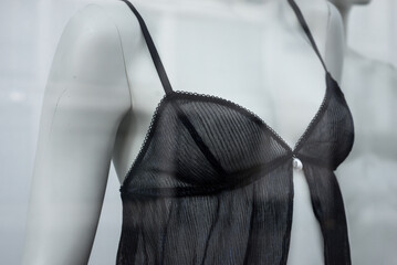 closeup of black transparent underwear on mannequin in a fashion store showroom