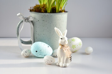 Easter composition with white rabbit and eggs in the sunlight on a white background. The minimal concept. - 787151971