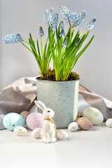 Easter composition with white rabbit, eggs and spring flowers. Easter still life