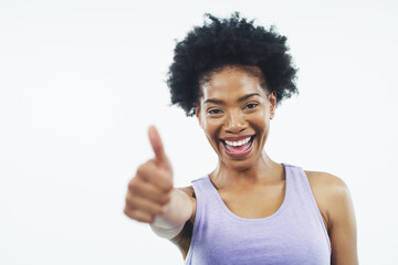 Thumbs up, fitness and portrait of black woman on a white background for training, workout and...
