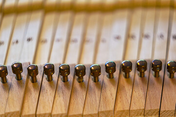Close-up of removed wooden keys of piano lying on table in living room at Swiss City of Zürich. Photo taken April 17th, 2024, Zurich, Switzerland.