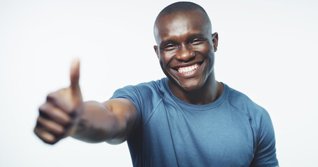Thumbs up, exercise and portrait of black man on a white background for training, workout and...