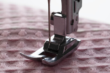 Sewing machine foot and needle plate with needle holder. Macro, industry. Copy space for text, overlock - 787161336