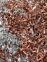 Mixed metal swarf, metal waste from a lathe. Copper and aluminium to be recycled