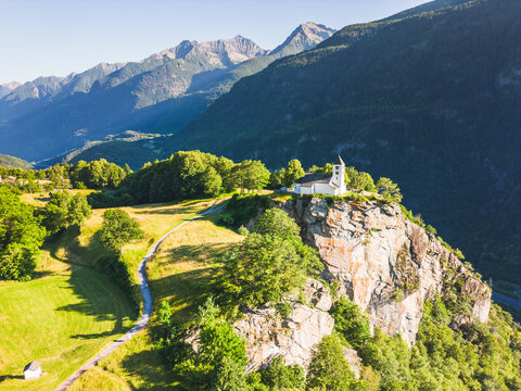 Aerial view of San Martino Church in Calonico during summer day, Leventina, Switzerland