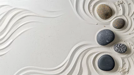 Schilderijen op glas Zen garden stones on white sand with pattern top view. © Ashley