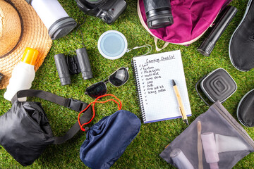 Camping checklist with various camp equipment. List of things for outdoors recreation and travel in nature - tent, first aid kit, cosmetics, accessories, equipment, clothes, trekking shoes - obrazy, fototapety, plakaty