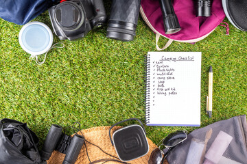 Camping checklist with various camp equipment. List of things for outdoors recreation and travel in nature - tent, first aid kit, cosmetics, accessories, equipment, clothes, trekking shoes - 787166975