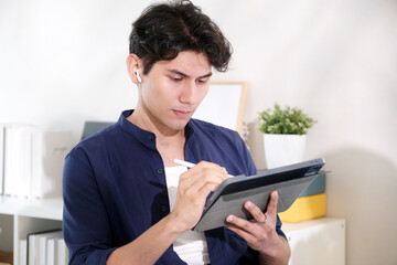 Young man using digital tablet, people and technology