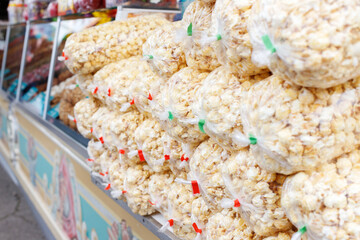 popcorn in bags for sale in an amusement park