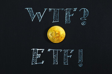 Bitcoin and ETF inscription in chalk close-up on a black background. - 787177759