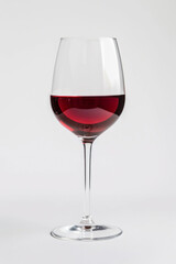 Isolated wine glass with red wine on a white background